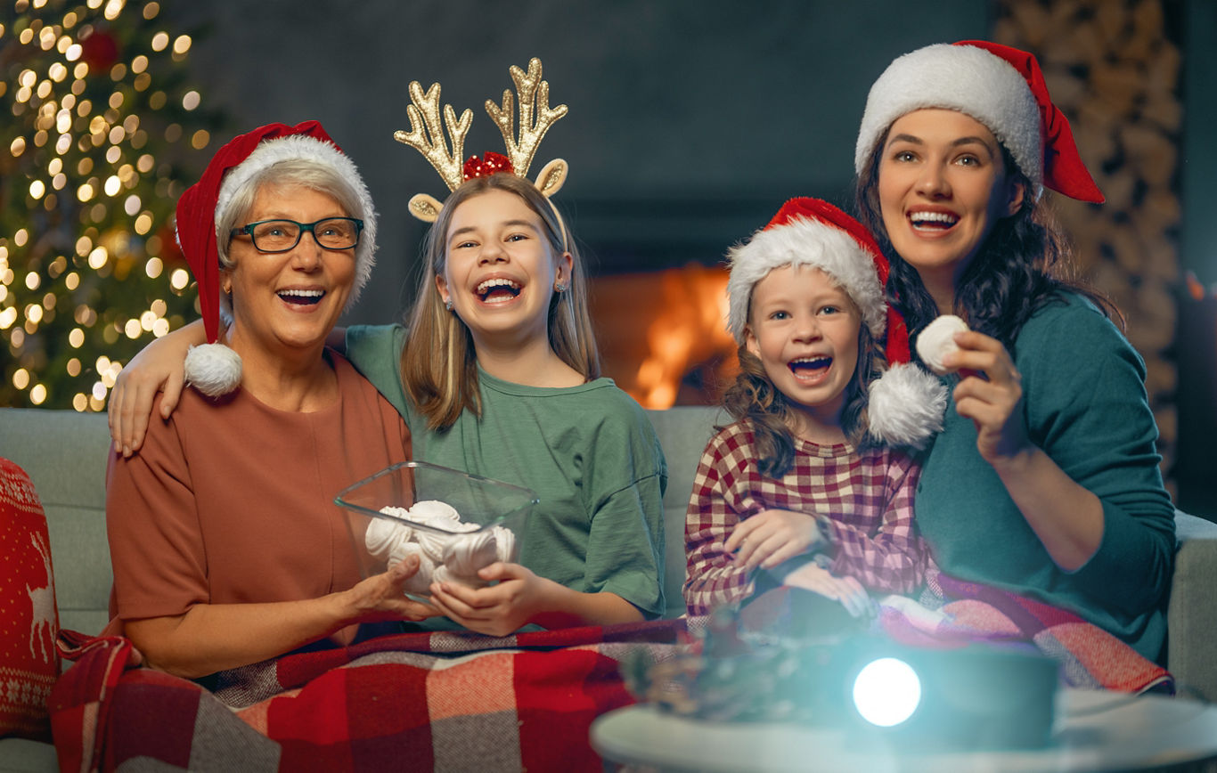 Family Laughing While Watching Christmas Film | Blog | Greystar